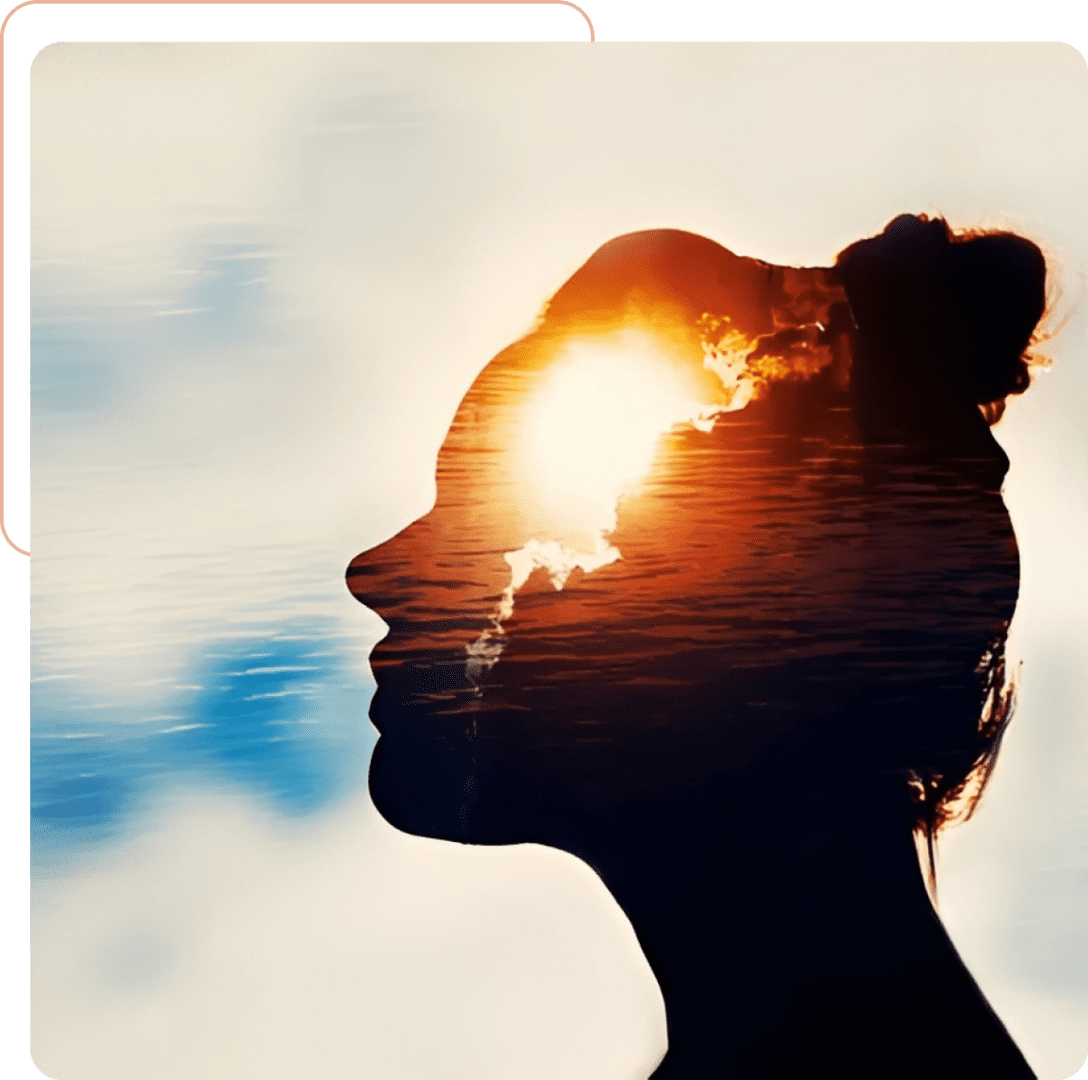 Silhouette of a woman with sun shining through her hair at sunset.